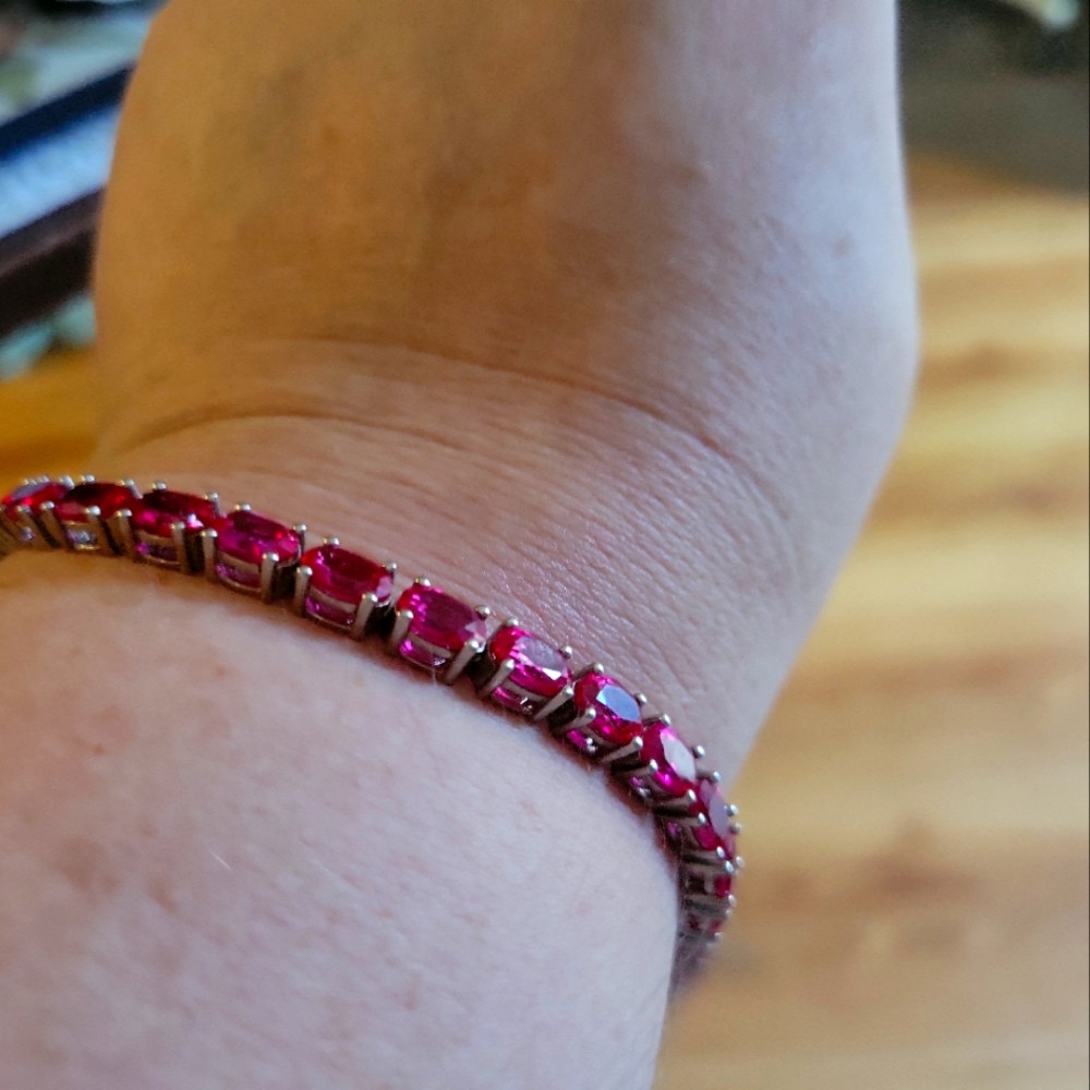 One 8 inch sterling silver ruby bracelet
